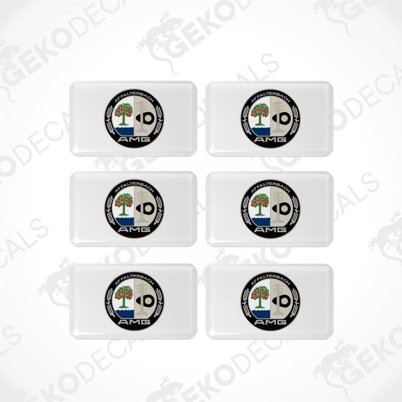A set of six white rectangular car decals with a black and green logo on them.
