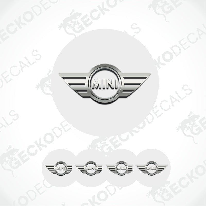 Set of white circular stickers with a silver 'MINI' logo on a light gray background.