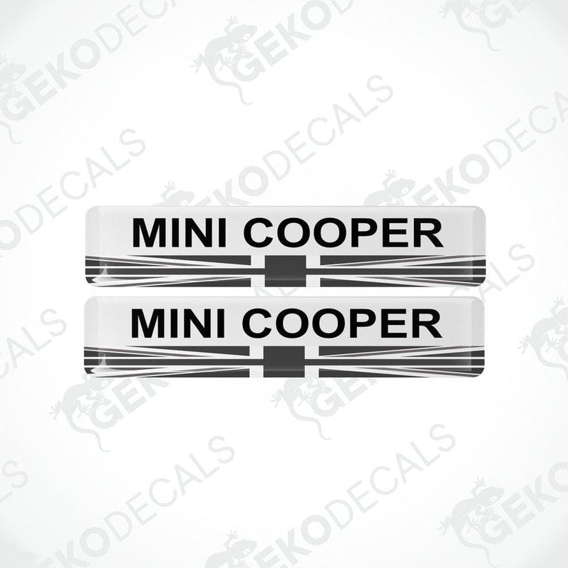 Two white, black, and red vinyl decals with the text 'MINI COOPER' on them.
