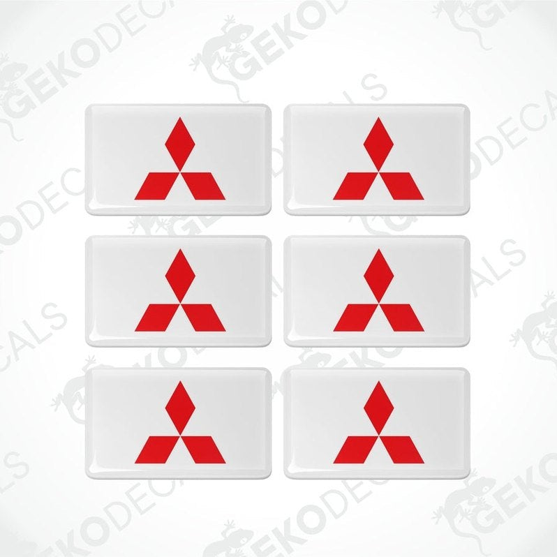 A set of six white vinyl stickers with a red Mitsubishi logo on each.