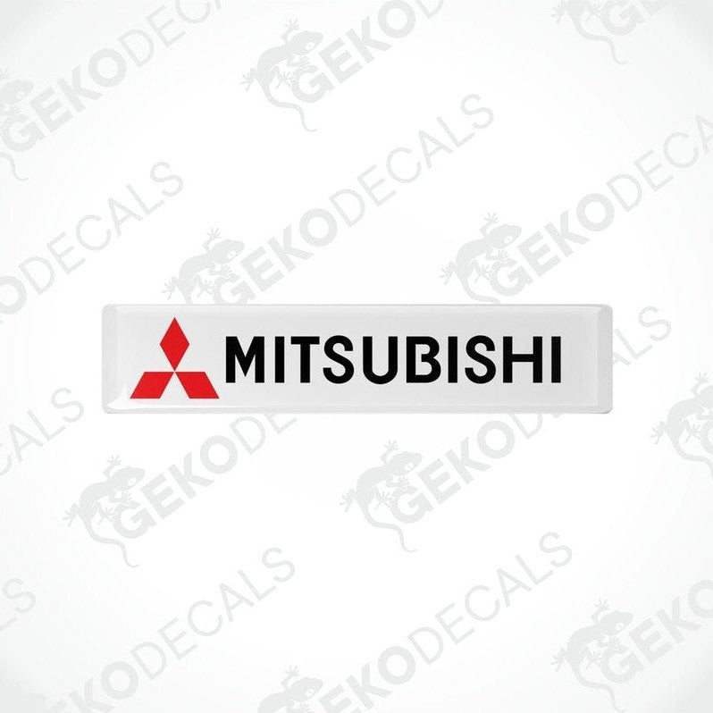 Rectangular white vinyl decals with the Mitsubishi logo in red and black.