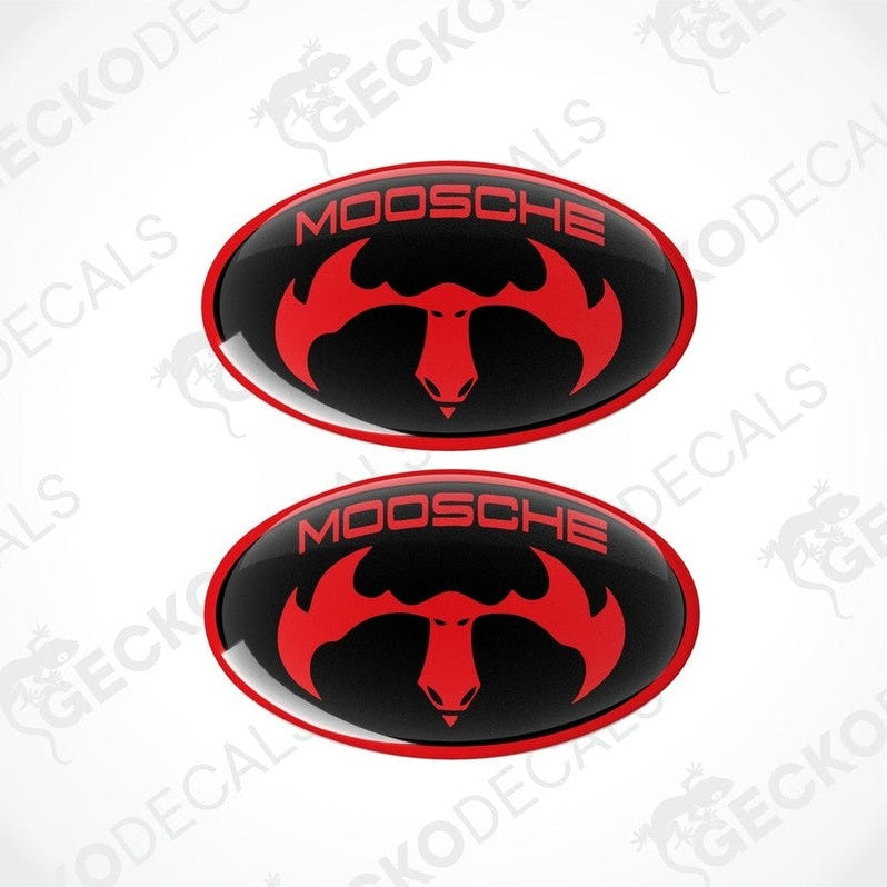 Two black oval car decals with the text 'MOOSCHE' and a moose silhouette in red.