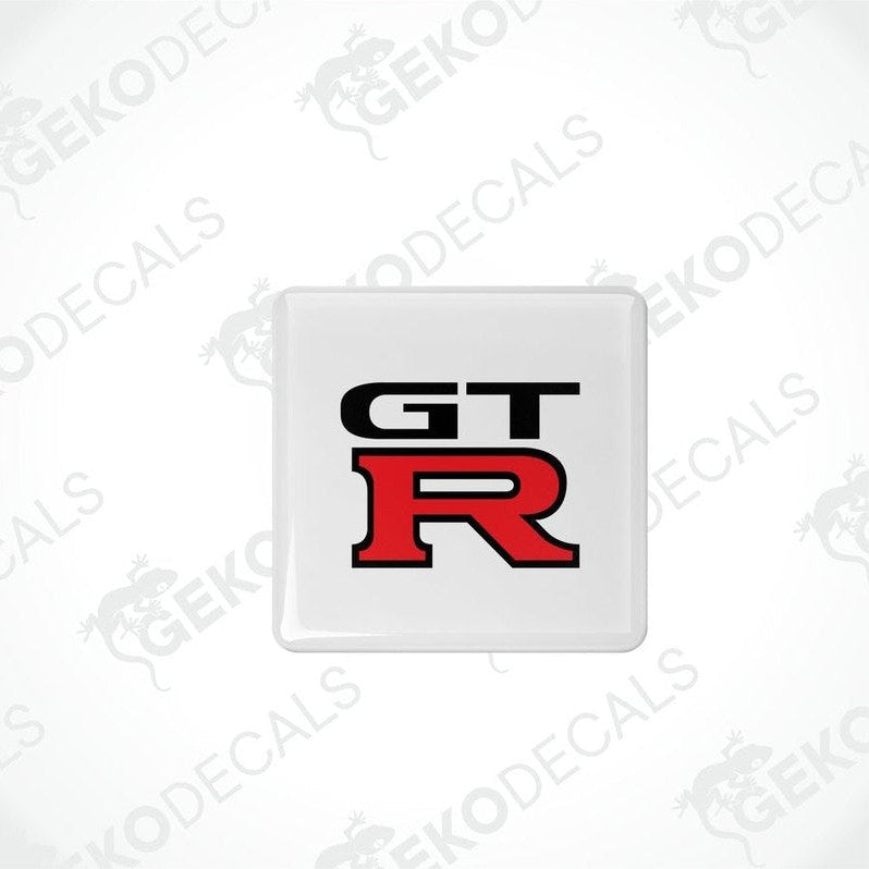 White vinyl stickers with the NISSAN GT R logo in red and black.
