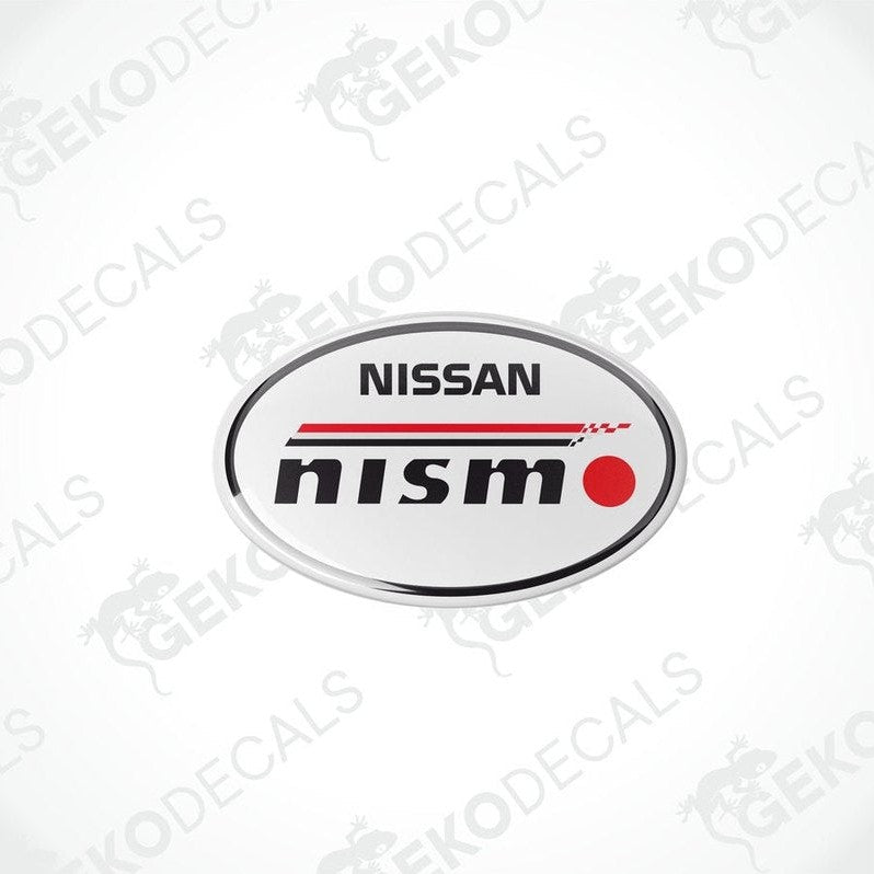 Oval-shaped vinyl decals with the NISSAN NISMO logo in black, red, and white colors.