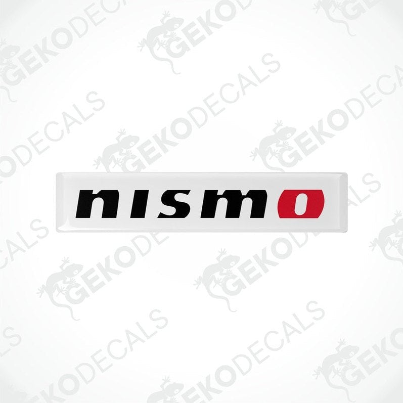 White, red, and black vinyl stickers with 'NISSAN NISMO' text and a logo.