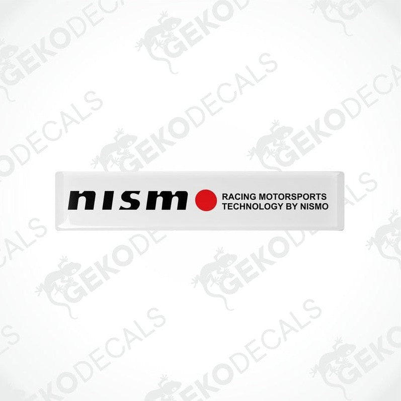 White vinyl stickers with red and black text, including 'NISSAN' and 'RACING MOTORSPORTS TECHNOLOGY BY NISMO'. GeckoDecals logo is visible in the corner.
