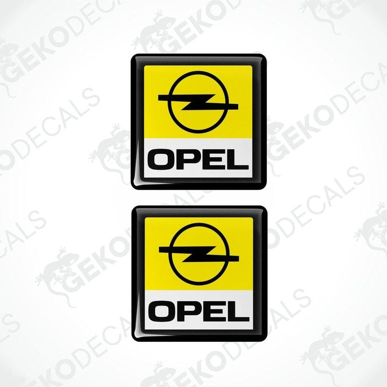 Two yellow, black, and white vinyl stickers with the word 'OPEL' on them, one with a Gecko Decals logo at the bottom.