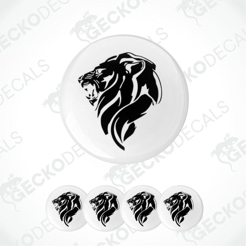 Set of five white coasters with black lion designs on a white background.
