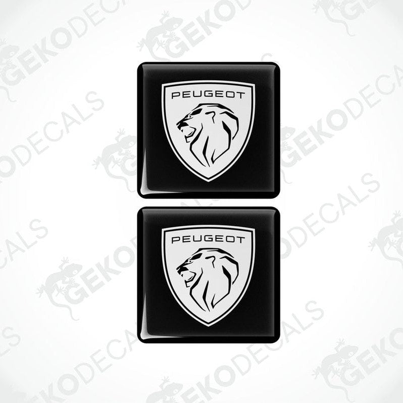 Two black vinyl stickers with a withe Peugeot logo and a lion graphic.