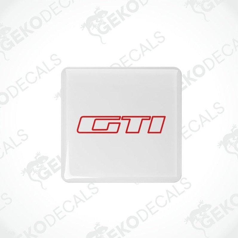 Withe vinyl stickers with the 'GTI' logo in red and white, placed on a white background.