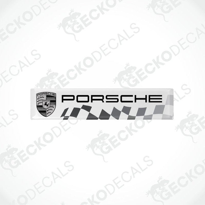 Withe vinyl stickers with the Porsche racing logo and a checkered pattern.
