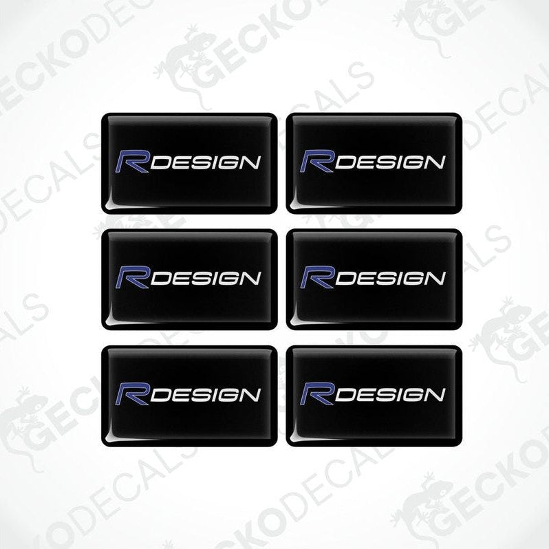 A set of six black vinyl stickers with the word 'R DESIGN' written in blue.