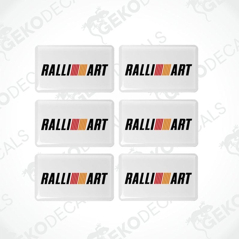 A set of six white vinyl stickers with a three-dimensional RALLIART logo