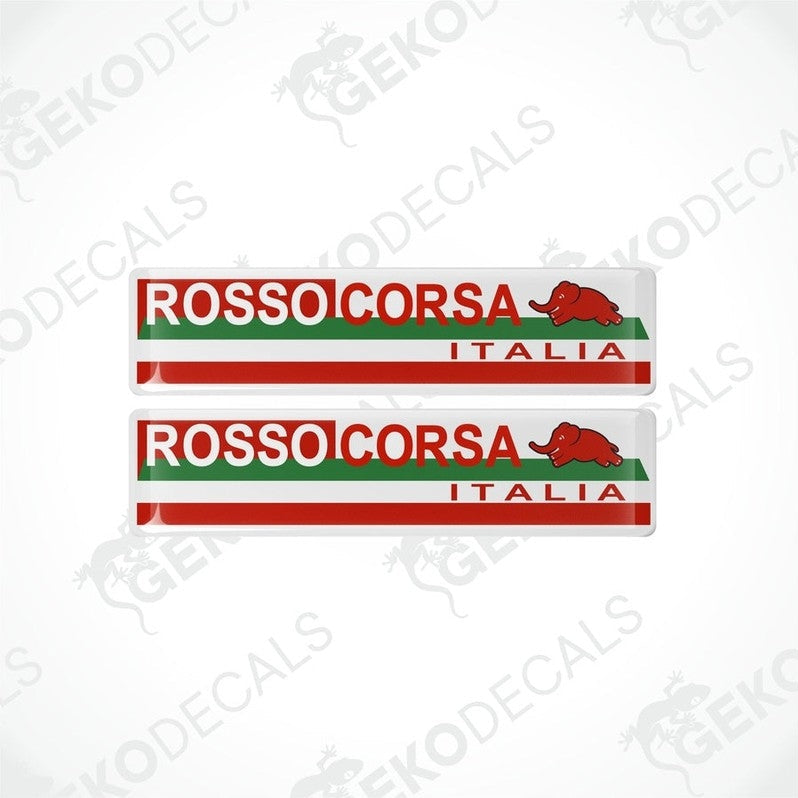 A pair of vinyl stickers with red, white, and green colors, featuring the text 'ROSSO CORSA ITALIA' and a green dinosaur logo.