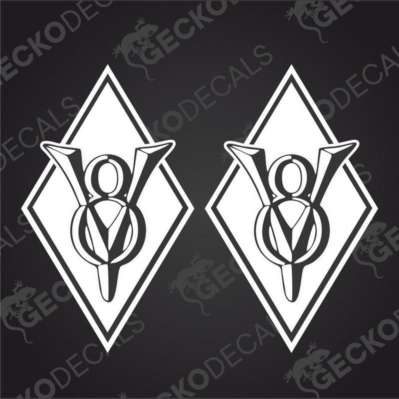Two white vehicle decals with a geometric design, featuring the letters V8 and X8, on a black background.