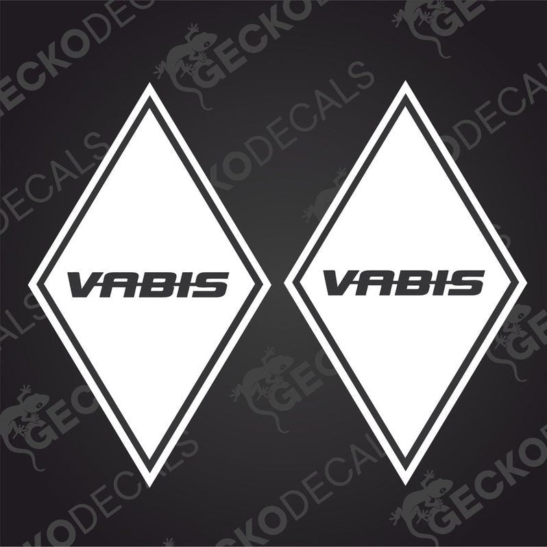 Two white diamond-shaped vehicle decals with the word 'VABIS' written in black.