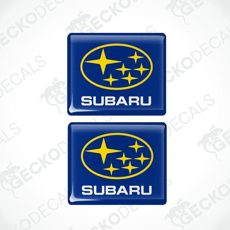 Two blue vinyl stickers with the SUBARU brand logo and stars.