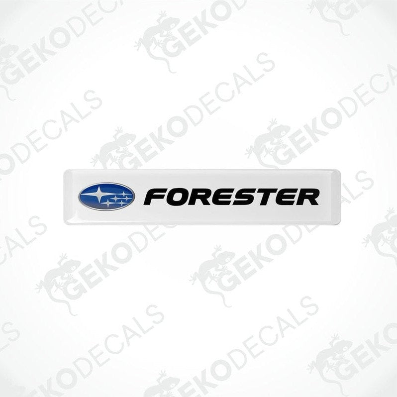 Withe vinyl stickers with the word 'FORESTER' and a graphical representation of a car above the text.