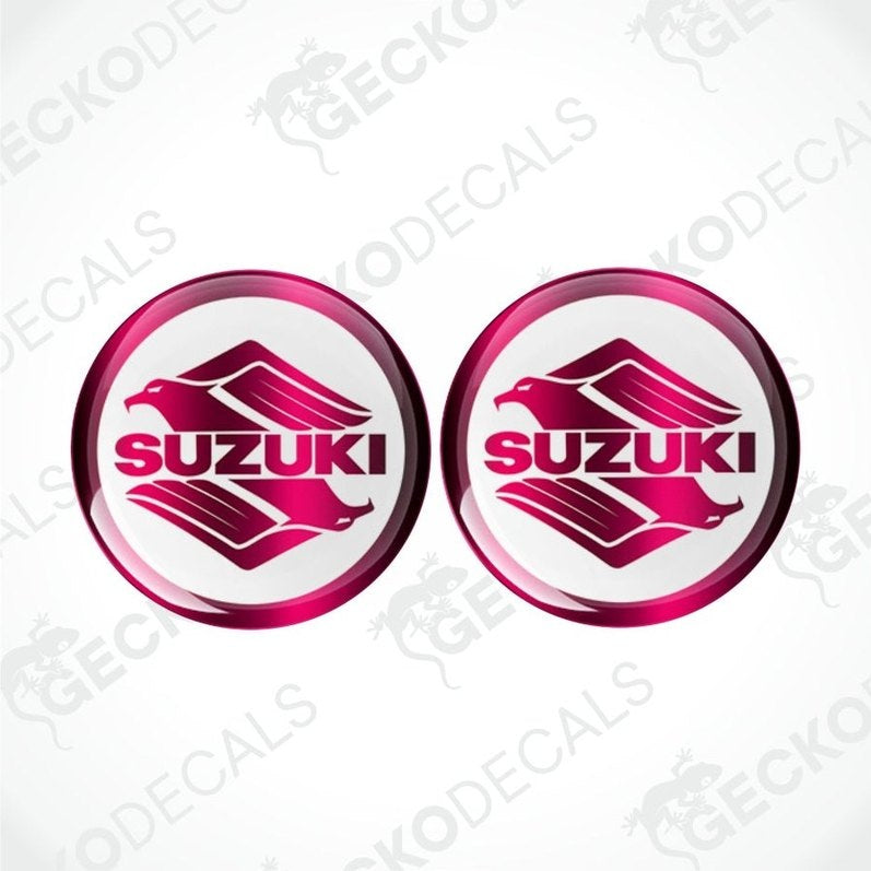 Two Suzuki logo stickers with a glossy finish on a white background.