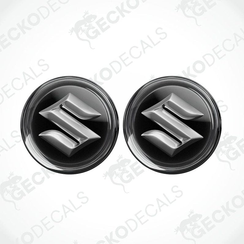 Two black and silver Suzuki logos on a white background with 'Gecko Decals' branding.