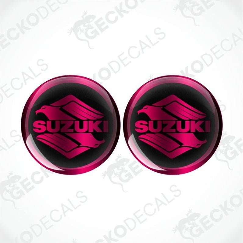 Two pink Suzuki logos on a white background with 'Gecko Decals' branding.