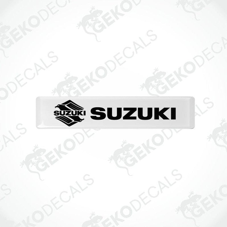 Withe vinyl stickers with the word 'SUZUKI' printed on them.