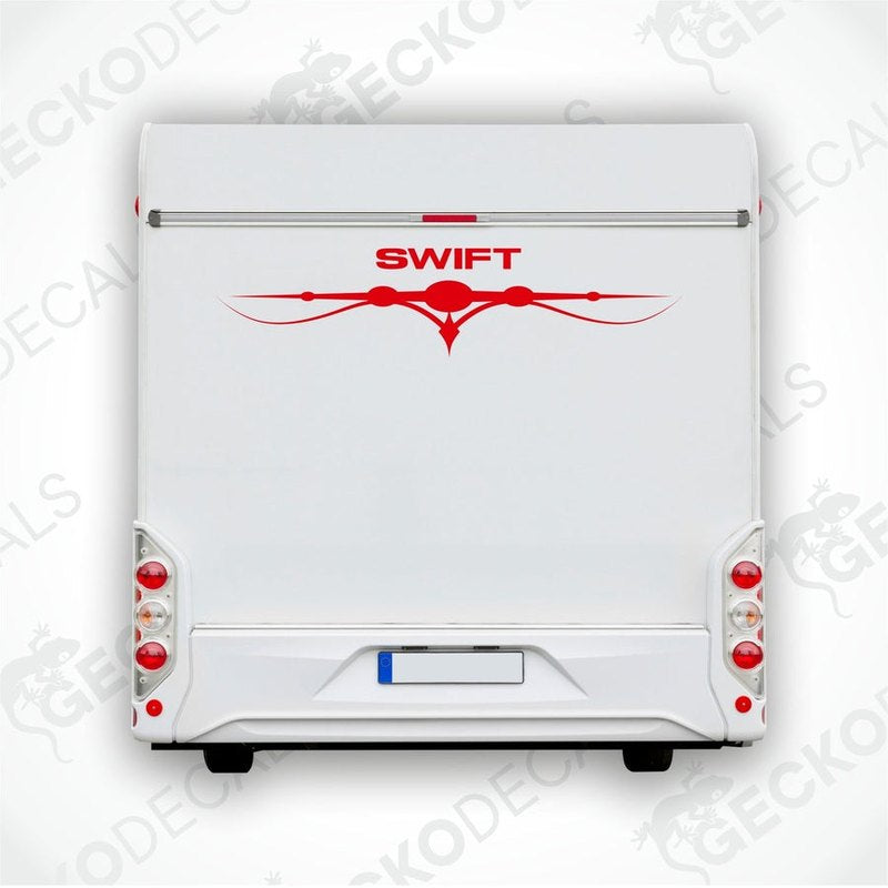 A white caravan with a red and black 'SWIFT' decal on the rear side.