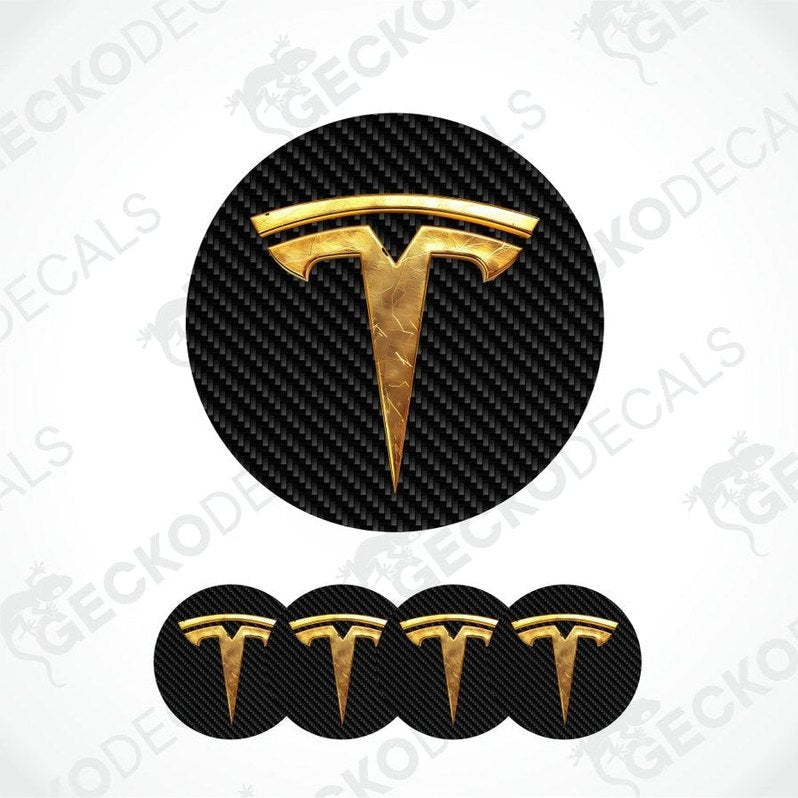 Gold Tesla logo decal on a carbon fiber pattern background