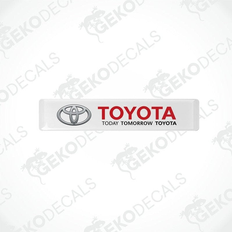 Withe vinyl stickers with the Toyota logo and the text 'TODAY TOMORROW TOYOTA' printed on them.