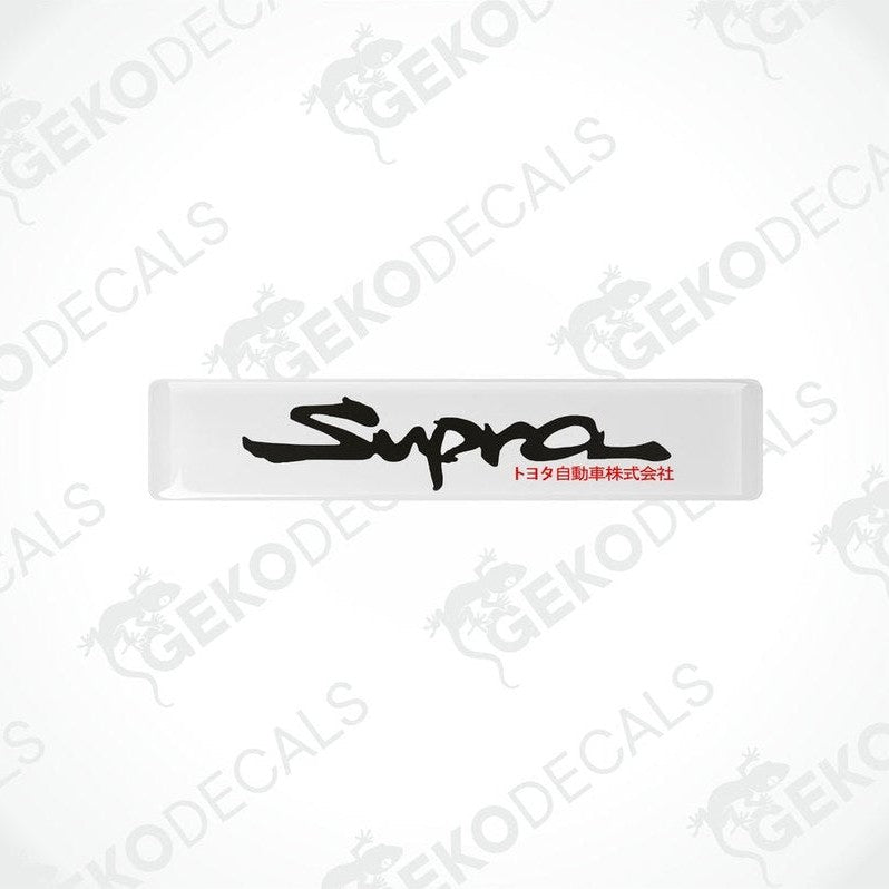 Withe vinyl stickers with the word 'SUPRA' written in black.