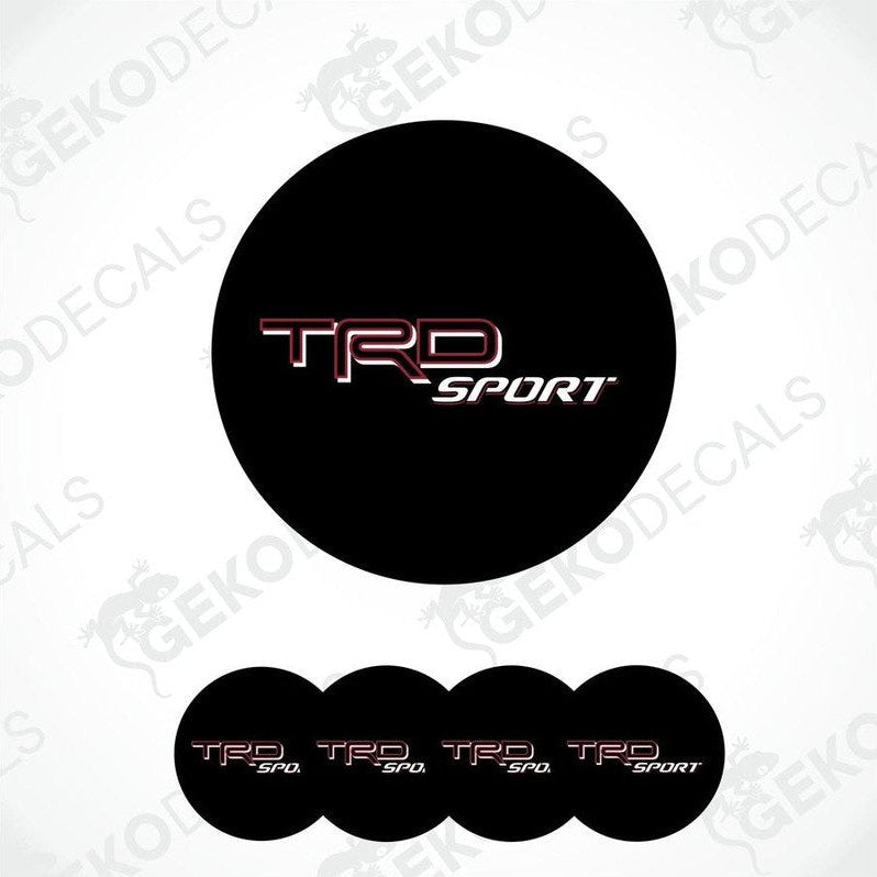 A set of black, red, and white vinyl decals with the TRD SPORT logo, designed for vehicle wheel caps.