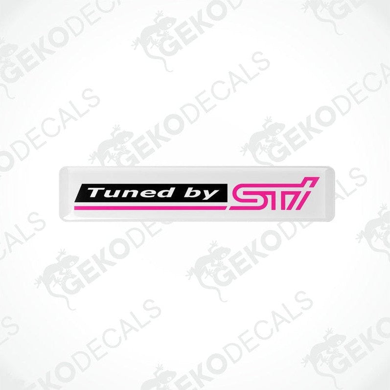 Rectangular vinyl decals with a polyurethane coating, black with pink text, featuring the 'Tuned by STI' logo.