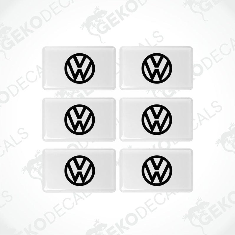 A set of six withe vinyl stickers with the Volkswagen logo on them.