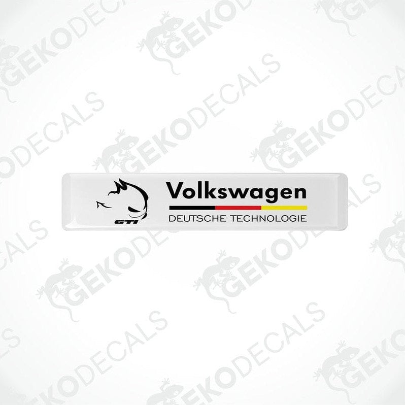Rectangular withe vinyl decals with 'Volkswagen' and 'DEUTSCHES TECHNOLgie' text in black and red-yellow colors