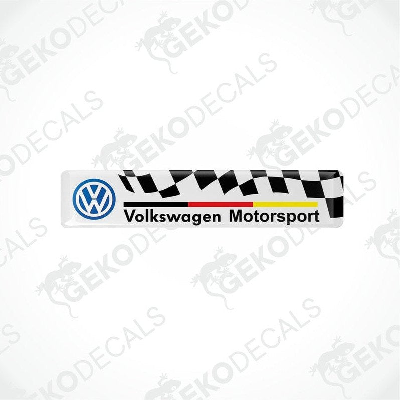 Vinyl stickers with the Volkswagen Motorsport logo, featuring a withe and black checkered pattern with red and yellow stripes.