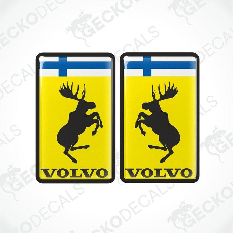 Two rectangular vinyl decals with a polyurethane coating featuring a yellow background, a moose silhouette, and the Volvo FINLAND brand logo.