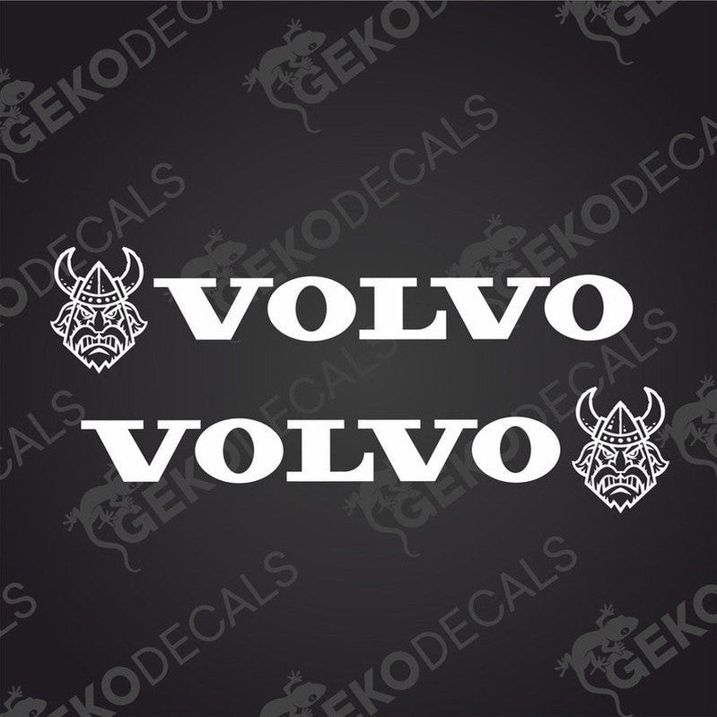 A set of two white Volvo vehicle decals, one with the brand name and a Viking helmet design, intended for use on vehicles either interior or exterior.