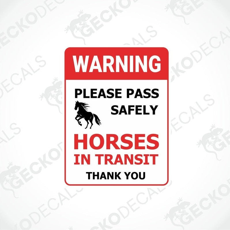 A rectangular warning sticker with a red background, featuring a white graphic of a horse and text that reads: WARNING PLEASE PASS SAFELY HORSES IN TRANSIT THANK YOU.