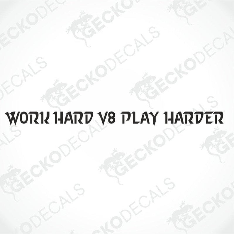 A decal with the text 'WORK HARD V8 PLAY HARDER' displayed on the windshield of a gray truck.