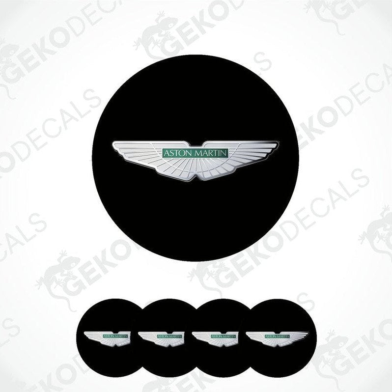 A set of four black vinyl stickers with a white Aston Martin logo on each.