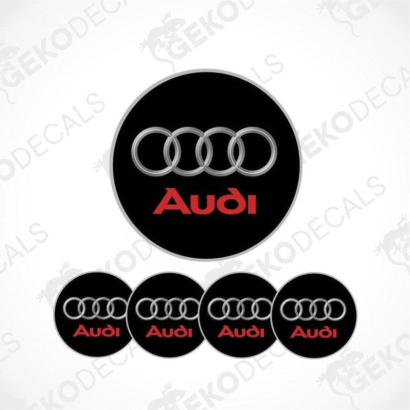 A set of four black vinyl stickers with the word 'AUDI' in red, displayed on a white background.