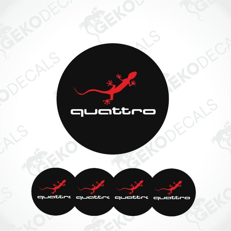 A set of four black vinyl stickers with red accents and the word 'QUATTRO' printed on them, designed for use on vehicle wheel caps.