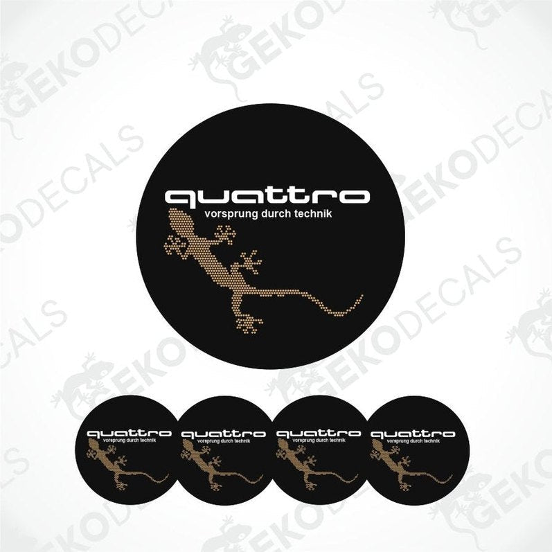Set of four black round car decals with the 'quattro' logo in gold, and one additional decal with a lizard image.
