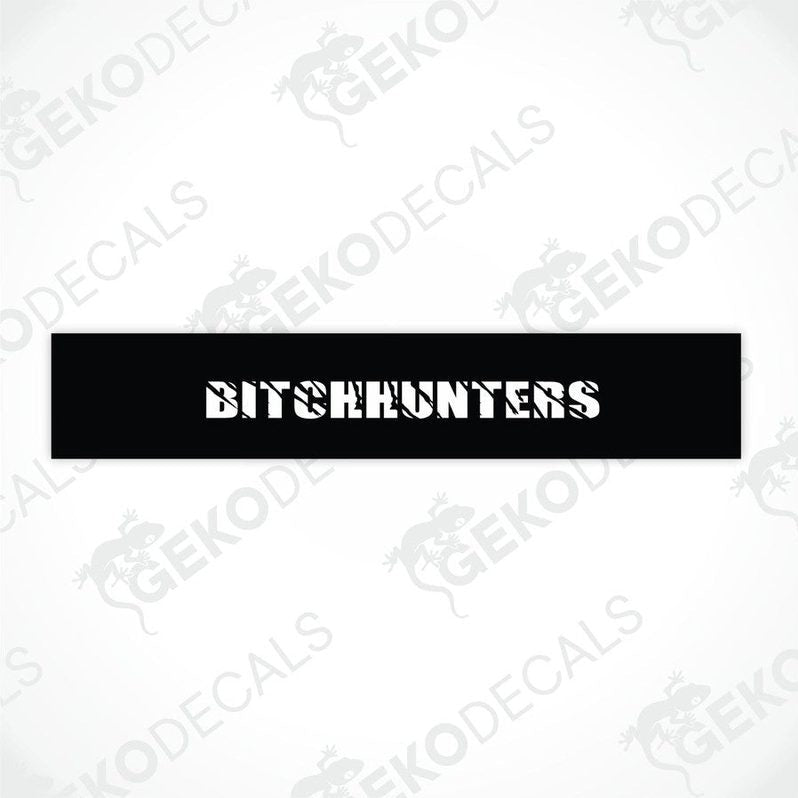 Black car windshield sun visor with white text BITCHHUNTERS