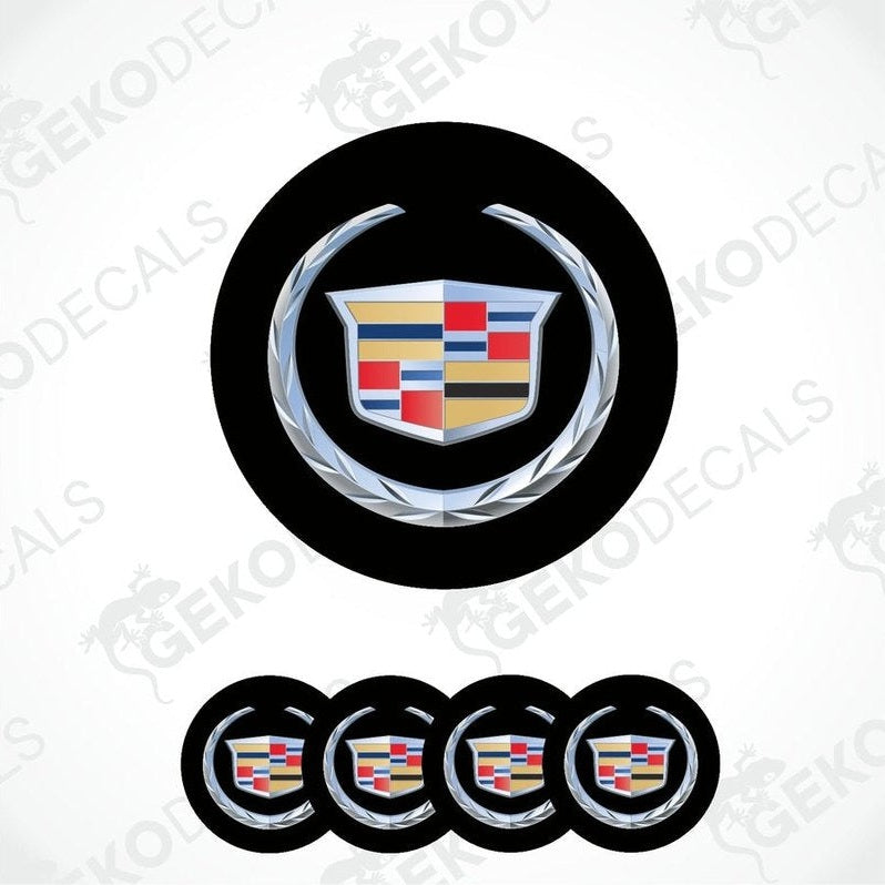 A set of four black round car decals with the Cadillac logo in the center.
