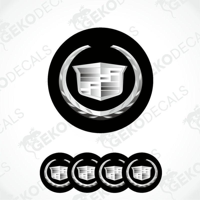 A set of black and white vinyl decals with a Cadillac logo design, intended for use as car wheel caps.