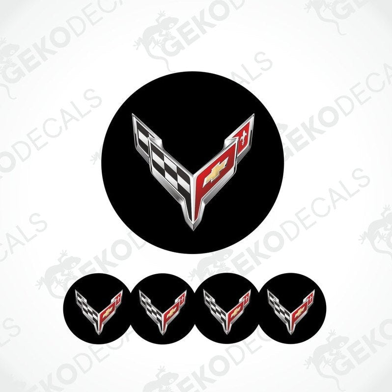 A set of four black vinyl stickers with a checkered pattern and the Chevrolet Corvette logo in the center.