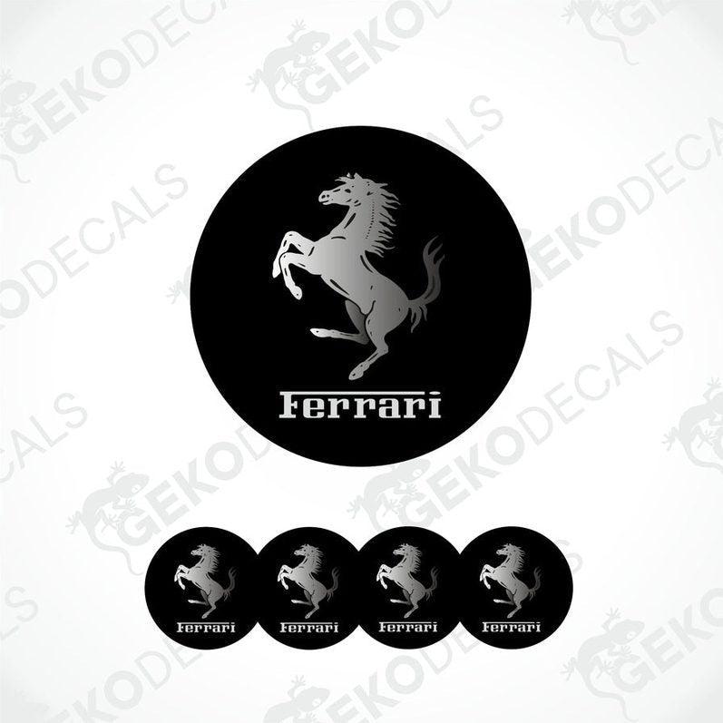 A set of four black vinyl stickers with a white Ferrari logo, designed for use on car wheels or caps.