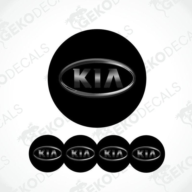 A set of four black vinyl stickers with the KIA brand logo on them.