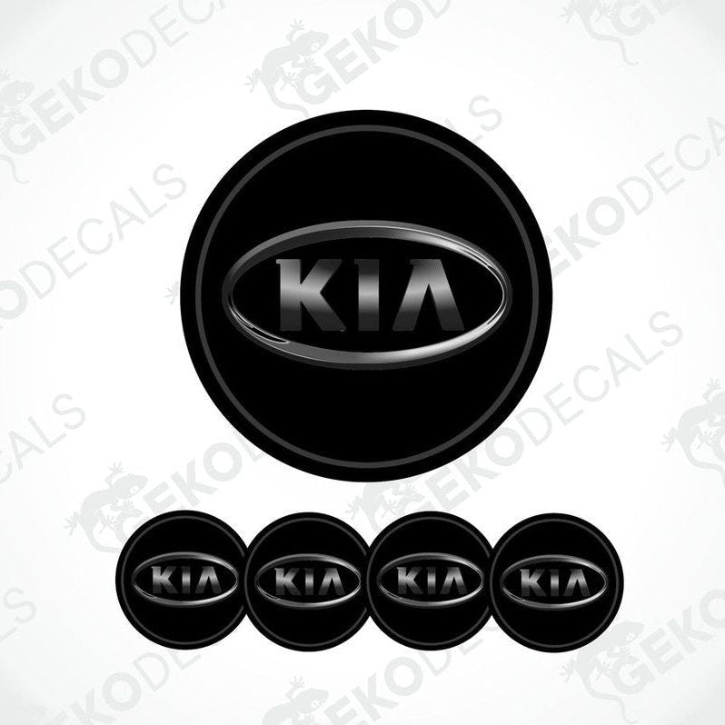 A set of four black vinyl stickers with the KIA brand logo on them.